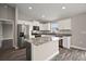 Modern kitchen featuring granite countertops, stainless steel appliances and white cabinets at 60 Walnut Dr, Ocala, FL 34480