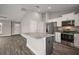 Open kitchen with granite countertops, stainless steel appliances and a large center island at 60 Walnut Dr, Ocala, FL 34480