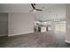 Open concept living room with wood floors that connects the kitchen and dining area at 60 Walnut Dr, Ocala, FL 34480