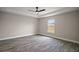 The main bedroom features modern floors, neutral walls, and a ceiling fan at 60 Walnut Dr, Ocala, FL 34480