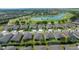 Aerial view of the neighborhood with a lake and golf course at 6376 Sw 97Th Terrace Rd, Ocala, FL 34481