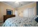 Bedroom with carpeted floors, access to the ensuite bathroom, and generous closet space at 6376 Sw 97Th Terrace Rd, Ocala, FL 34481