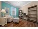 Cozy bedroom with chair, ottoman, desk, and shelving, offering a comfortable and functional space at 6376 Sw 97Th Terrace Rd, Ocala, FL 34481
