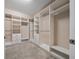Large walk-in closet with custom shelving, drawers, and hanging rods for ample storage at 6376 Sw 97Th Terrace Rd, Ocala, FL 34481
