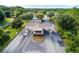 Aerial view of the gated community entrance with lush landscaping, and manicured grounds at 6376 Sw 97Th Terrace Rd, Ocala, FL 34481