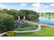 Stone Creek Community entrance with waterfall and beautiful landscaping at 6376 Sw 97Th Terrace Rd, Ocala, FL 34481