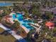 An aerial view shows the resort style pool area with tropical landscaping and walkways at 6376 Sw 97Th Terrace Rd, Ocala, FL 34481