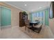 Dining room with tile flooring, modern accents, and a picturesque window view at 6376 Sw 97Th Terrace Rd, Ocala, FL 34481