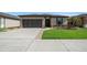 Charming single-story home featuring a well-manicured lawn, neutral paint, and a two car garage at 6376 Sw 97Th Terrace Rd, Ocala, FL 34481