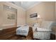 Cozy sitting area with chair, ottoman, and stylish decor at 6376 Sw 97Th Terrace Rd, Ocala, FL 34481