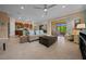 Open concept living room featuring recessed lighting, neutral paint, and a kitchen in the background at 6376 Sw 97Th Terrace Rd, Ocala, FL 34481