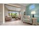 Bright living room showcases tile floors, neutral tones, and leads to a sunroom at 6376 Sw 97Th Terrace Rd, Ocala, FL 34481