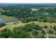 Aerial view of a golf course community featuring the home, lake, and landscape at 660 Silver Pass, Ocala, FL 34472