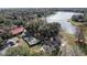 Aerial showcasing the community center, lake, playground, tennis and basketball courts at 660 Silver Pass, Ocala, FL 34472