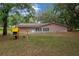 Expansive backyard featuring mature trees and a play structure at 660 Silver Pass, Ocala, FL 34472