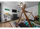 Charming bedroom featuring a unique teepee bed frame, a ceiling fan, and wood-look flooring at 660 Silver Pass, Ocala, FL 34472