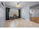 Bright and airy dining room with black curtains and tiled flooring at 660 Silver Pass, Ocala, FL 34472