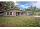 Well-maintained single-story home with an attached carport, and lush front lawn at 660 Silver Pass, Ocala, FL 34472