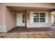 The home's covered front porch features brick accents and a white front door at 660 Silver Pass, Ocala, FL 34472