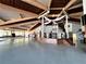 Spacious hall with high vaulted wooden ceilings, a stage and ample open space at 660 Silver Pass, Ocala, FL 34472