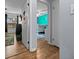 Hallway leading to a bright bedroom, providing a glimpse of the cozy living space at 660 Silver Pass, Ocala, FL 34472
