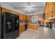 The kitchen features wood cabinets, sleek appliances, and a tiled backsplash at 660 Silver Pass, Ocala, FL 34472
