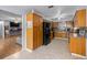 Well-appointed kitchen with oak cabinets and modern black appliances at 660 Silver Pass, Ocala, FL 34472