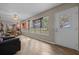 Spacious living room with flags hanging and access to a patio at 660 Silver Pass, Ocala, FL 34472