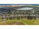 Scenic aerial view of a golf course community, showcasing meticulously manicured green spaces and residences at 7455 Sw 97Th Terrace Rd, Ocala, FL 34481