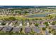 Stunning aerial view of a golf course community with lush landscaping and a tranquil lake at 7455 Sw 97Th Terrace Rd, Ocala, FL 34481