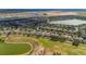 Breathtaking aerial view featuring a residential neighborhood with lake and golf course views at 7455 Sw 97Th Terrace Rd, Ocala, FL 34481
