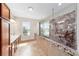 Modern bathroom featuring a seamless glass shower, soaking tub, and dual sink vanity at 7455 Sw 97Th Terrace Rd, Ocala, FL 34481