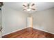 Bedroom featuring hardwood floors, ceiling fan and neutral color palette at 7455 Sw 97Th Terrace Rd, Ocala, FL 34481
