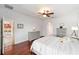 Light and bright bedroom featuring hardwood floors, ceiling fan and neutral color palette at 7455 Sw 97Th Terrace Rd, Ocala, FL 34481
