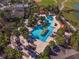 Stunning aerial view of the community pool with palm trees and resort-style amenities at 7455 Sw 97Th Terrace Rd, Ocala, FL 34481