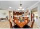 Dining room features wood furnishings with views of the kitchen at 7455 Sw 97Th Terrace Rd, Ocala, FL 34481