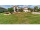 Well-maintained front lawn showcasing manicured landscaping and mature trees at 7455 Sw 97Th Terrace Rd, Ocala, FL 34481