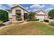 Lush front yard featuring decorative landscaping and manicured trees at 7455 Sw 97Th Terrace Rd, Ocala, FL 34481