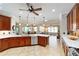 Open kitchen featuring a spacious island, stainless steel appliances, granite countertops, and a breakfast bar at 7455 Sw 97Th Terrace Rd, Ocala, FL 34481
