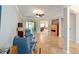 Spacious living room with tiled floors, neutral walls, ceiling fan, recessed lights and two plush chairs at 7455 Sw 97Th Terrace Rd, Ocala, FL 34481