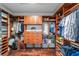 Spacious walk-in closet with custom wood shelving and hardwood floors at 7455 Sw 97Th Terrace Rd, Ocala, FL 34481