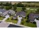Expansive aerial view of the home next to a golf course, showcasing lush landscaping and a circular driveway at 7585 Nw 33Rd Pl, Ocala, FL 34482