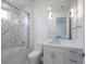 Elegant bathroom featuring a glass-enclosed shower, bathtub, and modern vanity with ample counter space at 7585 Nw 33Rd Pl, Ocala, FL 34482
