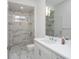 Clean, well-lit bathroom featuring a glass-enclosed shower, a modern vanity, and a large mirror at 7585 Nw 33Rd Pl, Ocala, FL 34482