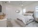 Bright bedroom with a comfortable bed, large window, and stylish decor and window at 7585 Nw 33Rd Pl, Ocala, FL 34482