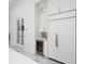 Bright kitchen featuring wine fridge, stainless appliances, and custom cabinets at 7585 Nw 33Rd Pl, Ocala, FL 34482
