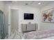 Main bedroom with marble floors, a stylish dresser, and an artistic butterfly-themed picture at 7585 Nw 33Rd Pl, Ocala, FL 34482