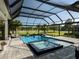 Relaxing pool and spa area surrounded by lush greenery, providing a private retreat at 7585 Nw 33Rd Pl, Ocala, FL 34482