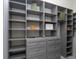 Walk-in closet featuring custom shelving and drawers at 7585 Nw 33Rd Pl, Ocala, FL 34482