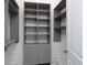 Spacious walk-in closet with custom shelving and drawers, offering ample storage space at 7585 Nw 33Rd Pl, Ocala, FL 34482